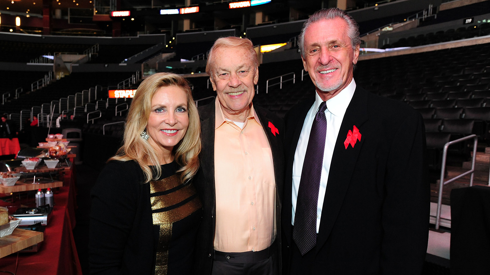 Dr. Jerry Buss with Pat and Chris Riley