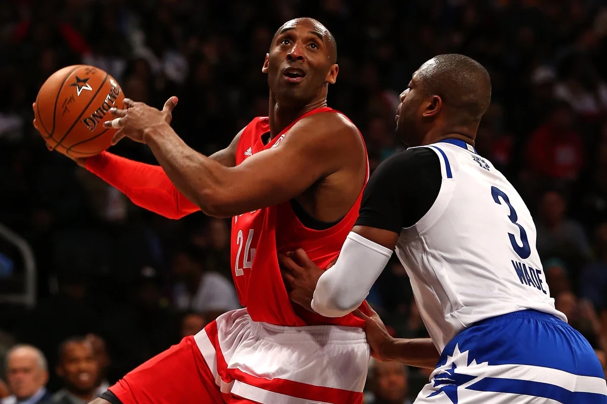 At the 2016 All-Star Game, Kobe Bryant readies a shot over friend and Olympic teammate Dwyane Wade.